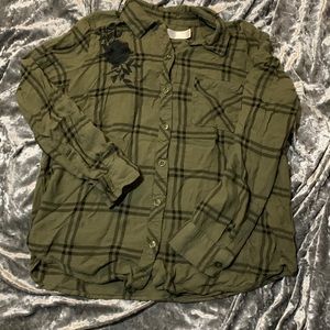 Green and black stripped flannel with rose embroidered on shoulder